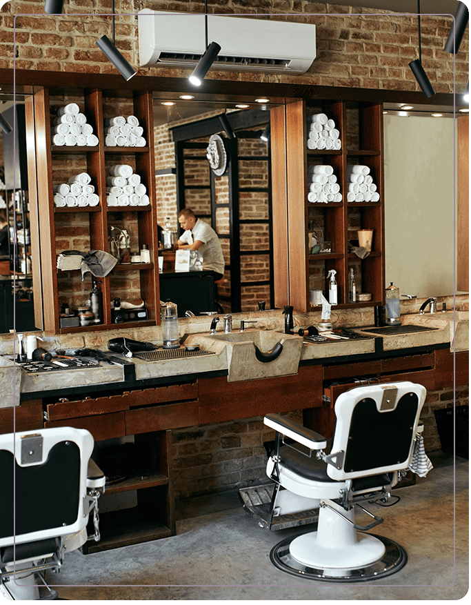 A barber shop with two chairs and a counter.